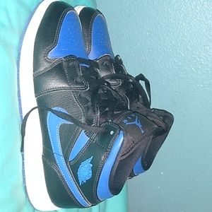 Black and blue Jordan 1's